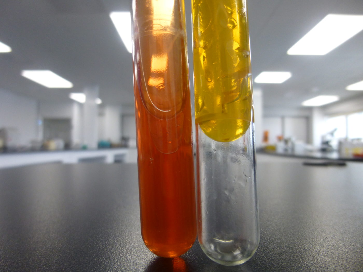 test tubes show variation in colour plus presence of gases